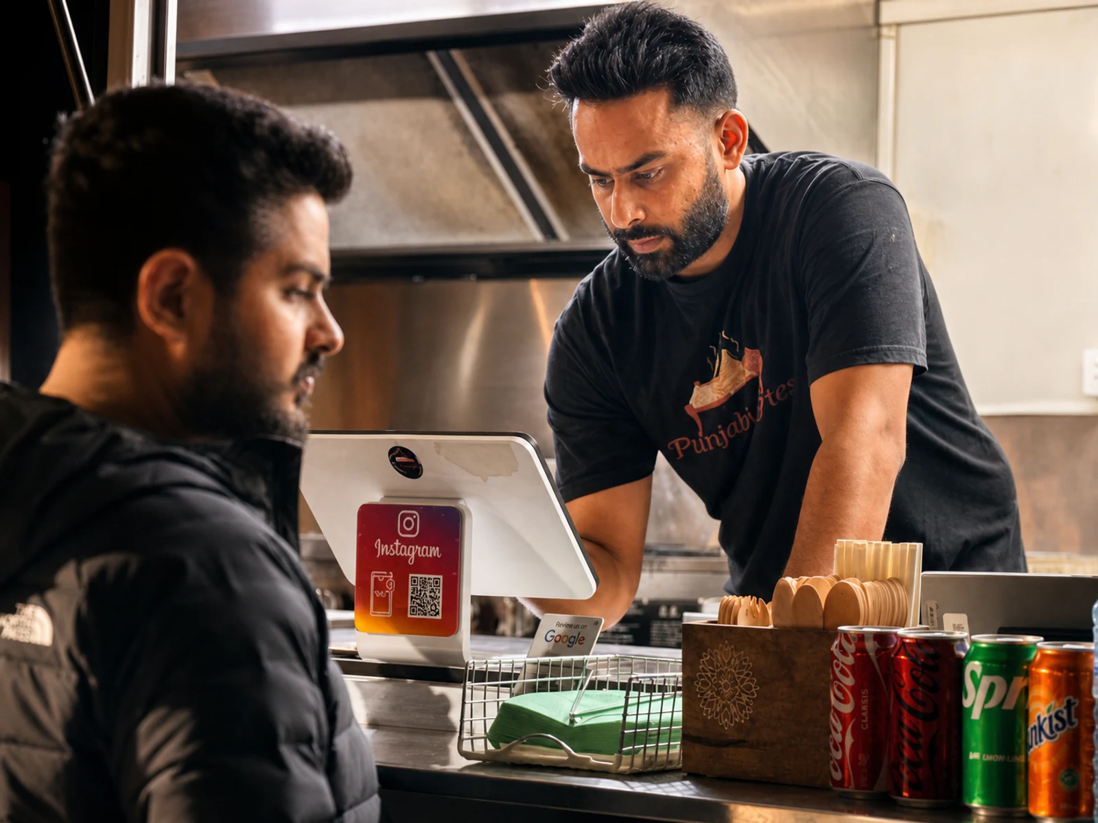 Satinder Singh serving a customer from the Punjabi Bytes food trailer in Woodridge